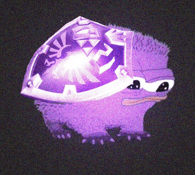 A grainy, meme-style image of a purple, fluffy character with big eyes wearing a large purple helmet adorned with symbols from The Legend of Zelda series.