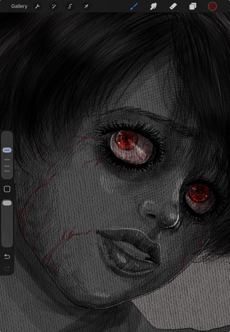 A digital sketch in a drawing app of a face with dark hair and red eyes.