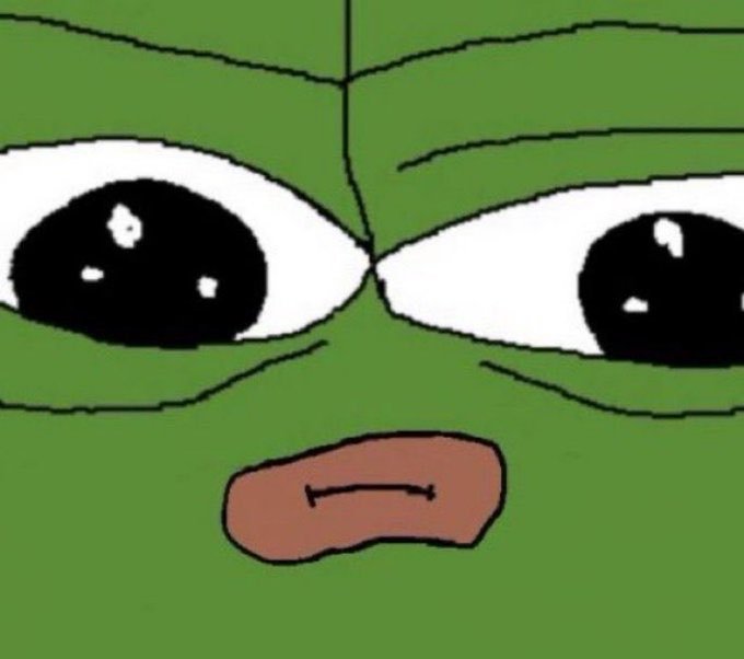 A green cartoon face with large, glossy eyes staring intently and a small, frowning mouth.