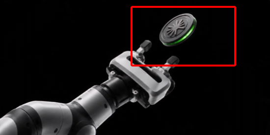 A 3D render of a robotic arm gripping a brake disc, with the disc highlighted in a red bounding box.