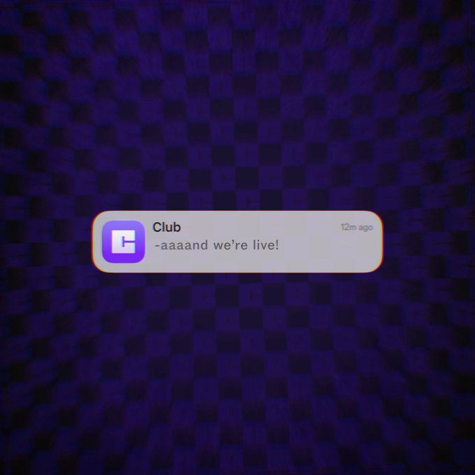 A mobile notification on a dark blue pixelated background from an app called 'Club' reading '-aaaand we're live!' sent 12m ago.