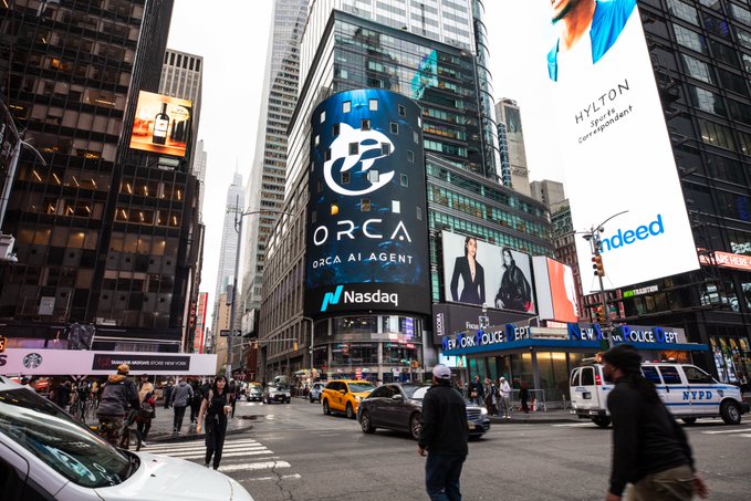 The Nasdaq Billboard in Times Square prominently displays the "ORCA AI AGENT" logo, marking ORCA's milestone debut on one of New York's most iconic screens, as celebrated in the accompanying post about ORCA's growing global presence.