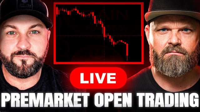 The image features a man with a beard wearing a baseball cap sitting next to another man who also has a beard. Both men are wearing black t-shirts that have the words "Live Premarket Open Trading" printed on them, along with a banner in red and white colors with information about an upcoming live trading event. The background of the image is dark blue, but there's a hint of a greenish color visible, possibly indicating some sort of indicator or chart related to the crypto market.