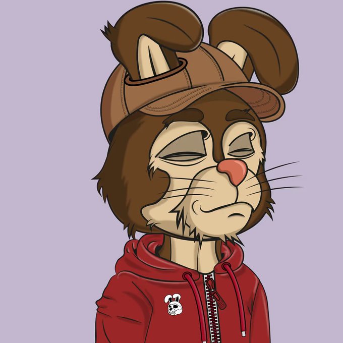 A digital drawing of a brown anthropomorphic mouse or rabbit-like character with closed eyes, wearing a red zip-up hoodie featuring a small skull mouse logo, set against a light purple background.