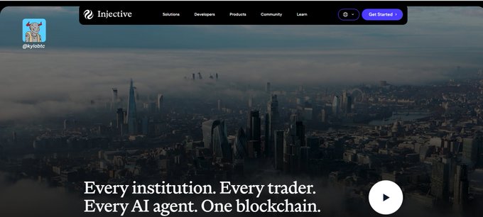 A screenshot of the Injective blockchain website shows an aerial view of a foggy city skyline. The text reads 'Every institution. Every trader. Every AI agent. One blockchain.' next to a play button, with a 'Get Started' button in the navigation bar.