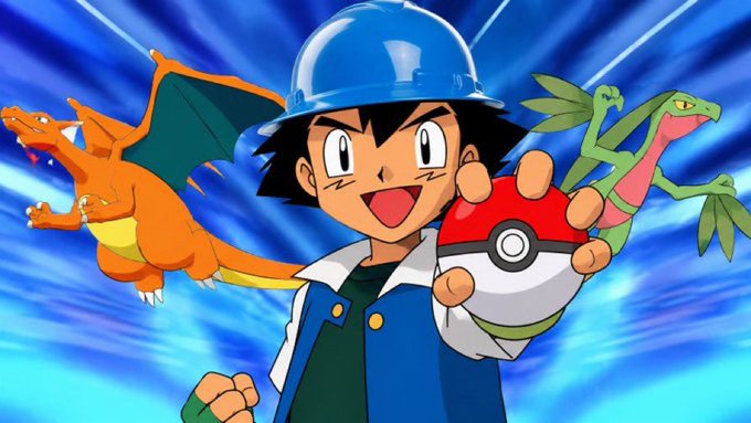 Ash Ketchum from the animated series Pokémon poses confidently holding a Pokéball, flanked by a Charizard and a green lizard Pokémon against a dynamic blue background.