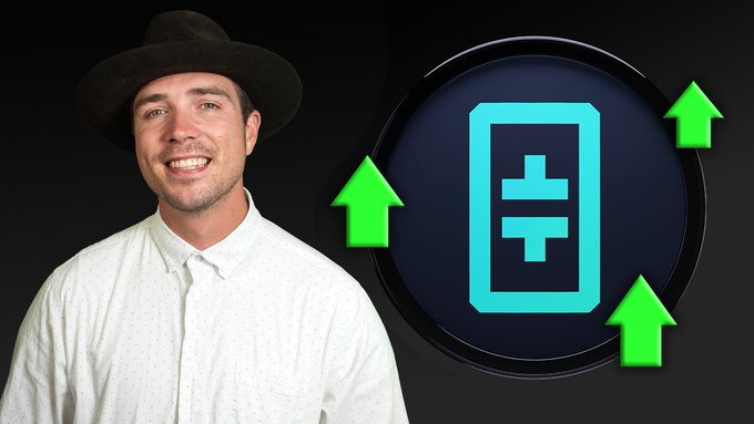 A man wearing a brown hat and a white patterned shirt smiles next to a circular graphic featuring a cyan cryptocurrency symbol (resembling Theta Network's logo) surrounded by three upward green arrows on a black background, conveying positive market momentum for the Theta Network video highlighted in the accompanying post.