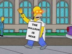 A scene from The Simpsons showing Homer Simpson dressed in a suit and tie holding a sign that reads "THE BULLRUN IS NEAR."
