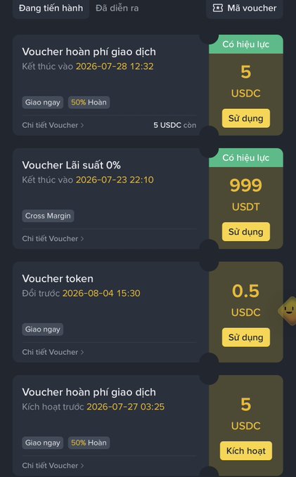 A Vietnamese cryptocurrency exchange interface showing various vouchers including 'Voucher hoàn phí giao dịch' (transaction fee refund voucher) worth 5 USDC, 'Voucher Lãi suất 0%' (0% interest voucher) worth 999 USDT, and others with expiration dates.