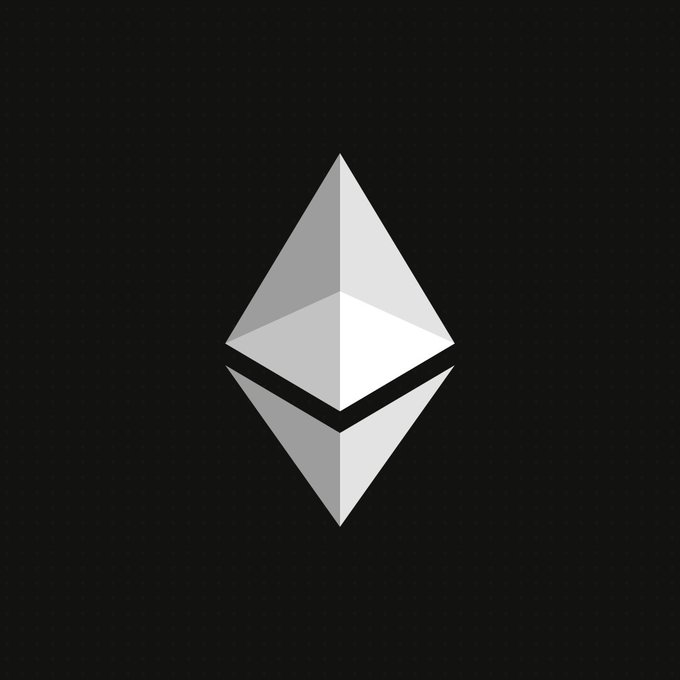 The Ethereum logo, a silver geometric diamond/octahedron shape on a black background.