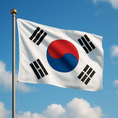 The South Korean flag flies against a blue sky, symbolizing the nation discussed in the news about won-backed stablecoins potentially saving South Korean merchants $3.8 billion annually in fees. The image visually anchors the story about South Korea's emerging digital currency landscape.