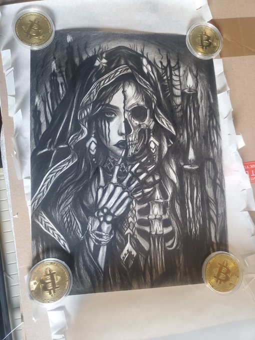 A black and white drawing of a hooded figure whose face is half human and half skull, taped to a surface with four Bitcoin coins placed at the corners.