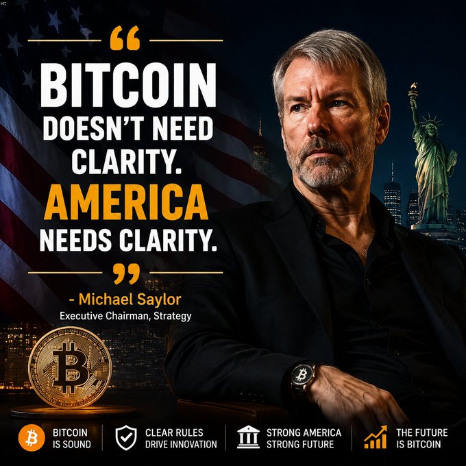 A promotional image featuring Michael Saylor, Executive Chairman of Strategy, with a quote 'BITCOIN DOESN'T NEED CLARITY. AMERICA NEEDS CLARITY' against a backdrop with the Statue of Liberty, American flag, and a Bitcoin coin.