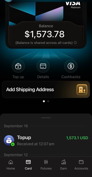 A screenshot of a Visa Platinum card app interface showing a balance of $1,573.78, with options for 'Top up', 'Details', and 'Cashbacks', and a recent top-up transaction of 1,573.1 USD on September 16.
