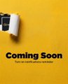 A bright yellow graphic features a paint roller in the upper left corner alongside bold black text reading "Coming Soon" with smaller text below stating "Sign up to read all posts available." The image's promotional design pairs with the caption about Binance, suggesting the user may have stumbled upon an unreleased or upcoming feature on the platform.