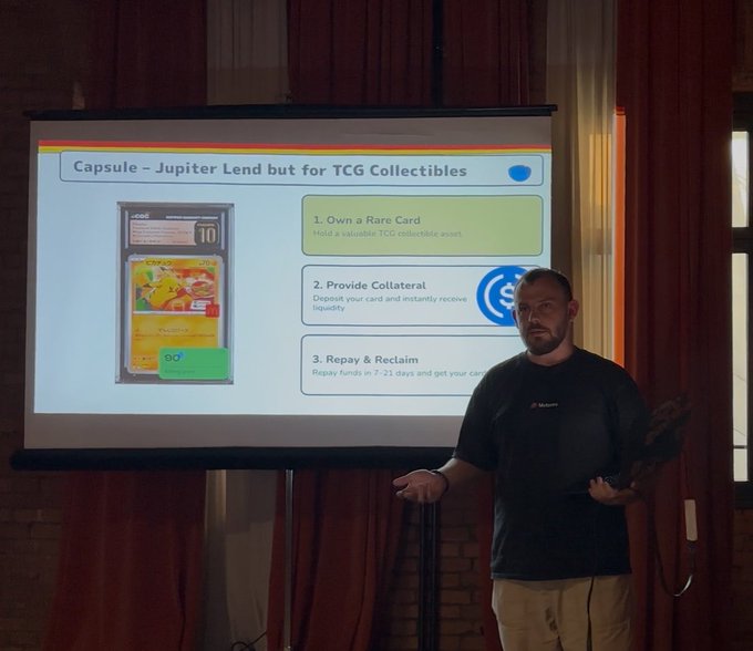 A man presenting a slide titled 'Capsule - Jupiter Lend but for TCG Collectibles' which explains a three-step process: '1. Own a Rare Card', '2. Provide Collateral', and '3. Repay & Reclaim'.