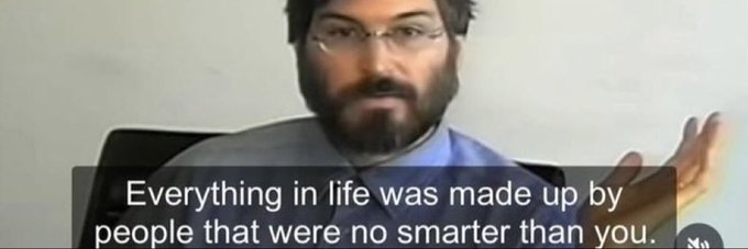 A motivational image of a bearded man with glasses gesturing, captioned "Everything in life was made up by people that were no smarter than you."