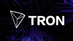 The white TRON cryptocurrency logo (a 3D triangular shape) against a dark circuit board background.
