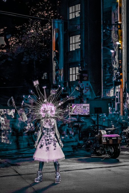 A futuristic, cyberpunk-style digital art piece depicts a girl in a white dress with glowing, radiating wires and screens emerging from her head, standing on a city street at night.