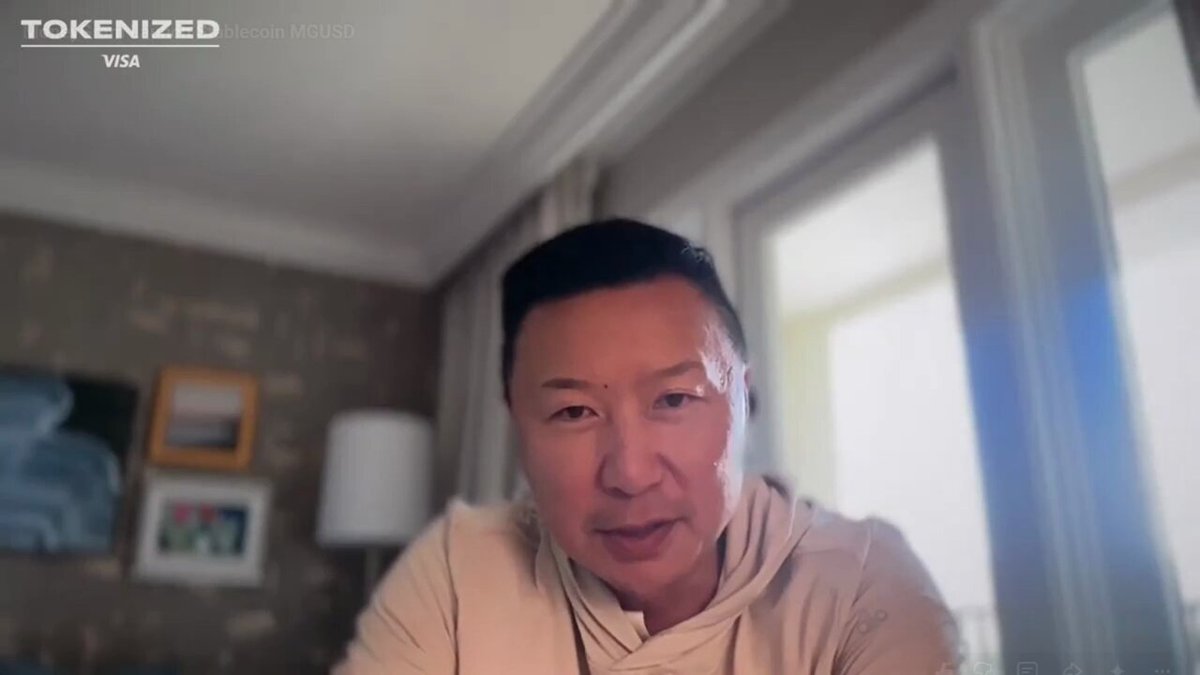 The image features a man sitting at a desk with his head tilted back as he looks directly into the camera. The background of the image shows a window that allows natural light to enter the room, creating an inviting atmosphere for the viewer. There are also some paintings on the wall behind the man, adding artistic elements to the scene. The post about the MoneyGram CEO and their stabelcoin launch is located in the bottom right corner of the image.