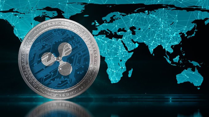 A silver Ripple (XRP) cryptocurrency coin featuring its logo is displayed against a teal digital world map with connecting nodes, visually representing Ripple's global cross-border payment network spanning 190+ countries. The coin's inscription and circuitry design reinforce the post's theme of XRP-powered international payment infrastructure expansion through enterprise and RLUSD initiatives.