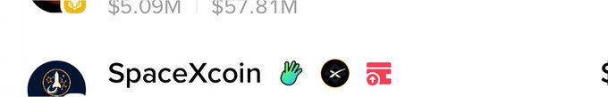 A screenshot showing the text 'SpaceXcoin' alongside waving hand, X, and a storefront emoji, with market cap figures '$5.09M' and '$57.81M' visible above.