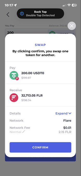 A mobile app displays a crypto swap confirmation screen showing an exchange of 200.00 USDT0 ($199.87) for 32,713.05 FLR ($198.34) on the Flare network, with a $0.01 network fee. The substantial FLR amount received supports the post's bullish sentiment about $FLR at current prices.