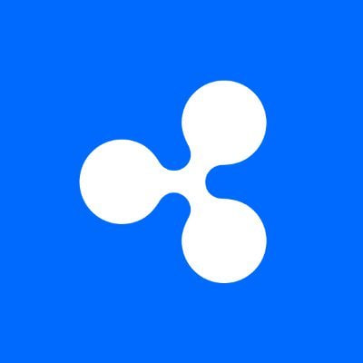 The image displays the white Ripple (XRP) logo on a blue background. This relates to the post as Ripple Prime, a subsidiary of Ripple, has launched Delta One, marking the company's first expansion into institutional stock trading.
