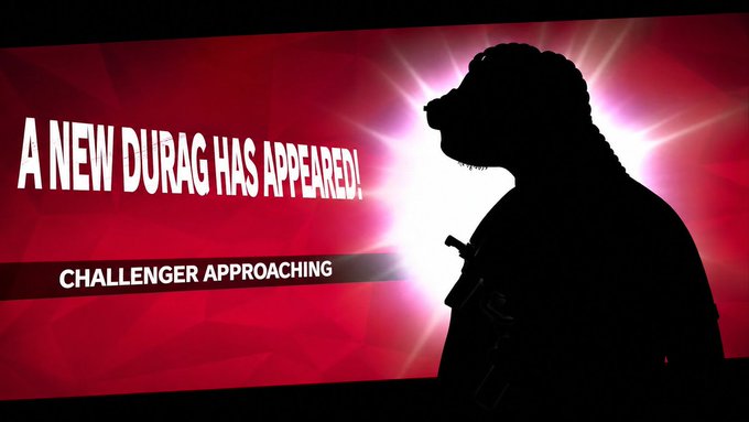 A silhouetted character appears against a glowing red background with the text “A NEW DURAG HAS APPEARED!” and “CHALLENGER APPROACHING.” The “challenger” framing highlights @duragsociety’s upcoming NFT collection as a notable new PFP project designed to offer more than wallet artwork.