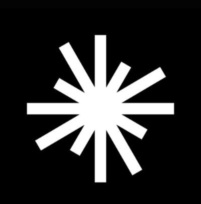 A white starburst or asterisk-like logo on a black background.