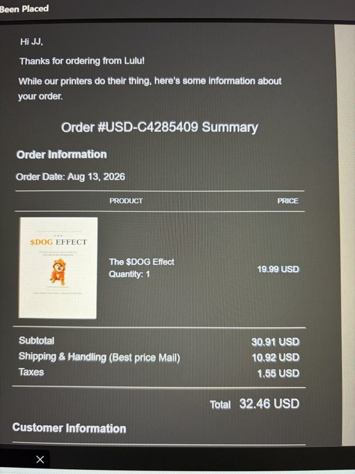 A photograph of an order confirmation screen from Lulu, displaying 'Order #USD-C4285409 Summary' for 'The $DOG Effect' at 19.99 USD, totaling 32.46 USD, with the order date listed as Aug 13, 2026.