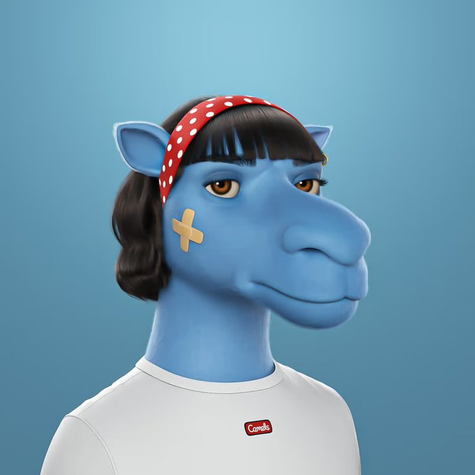 A 3D rendered portrait of a blue giraffe-like creature with human-like black hair, wearing a red polka-dot headband and a white t-shirt with a red logo reading "Comels".