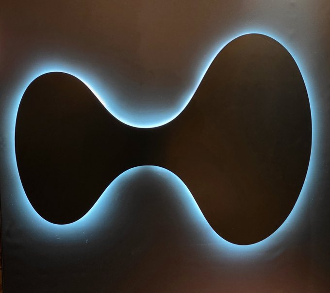 A glowing blue infinity or figure-eight symbol set against a dark background, evoking themes of endless cycles and eternal possibilities. The looping shape visually reinforces the post's commentary on the cyclical nature of projects that proclaim longevity but ultimately fade, suggesting the irony of promises meant to last forever.