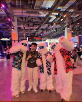 A man poses with performers in fluffy white costumes at an indoor event venue with vibrant lighting, likely during the Sui Network Basecamp conference in Singapore. The celebratory atmosphere in the image captures the excitement of the record-breaking 40 million TPS milestone announcement referenced in the post.