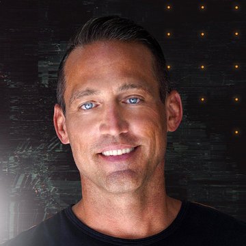A smiling man with blue eyes poses against a dark backdrop featuring warm string lights, likely Mark Moss as referenced in the accompanying Bitcoin price prediction quote. The image visually anchors the post's bold forecast of Bitcoin reaching $1M by 2030, $14M by 2040, and $45M by 2050.