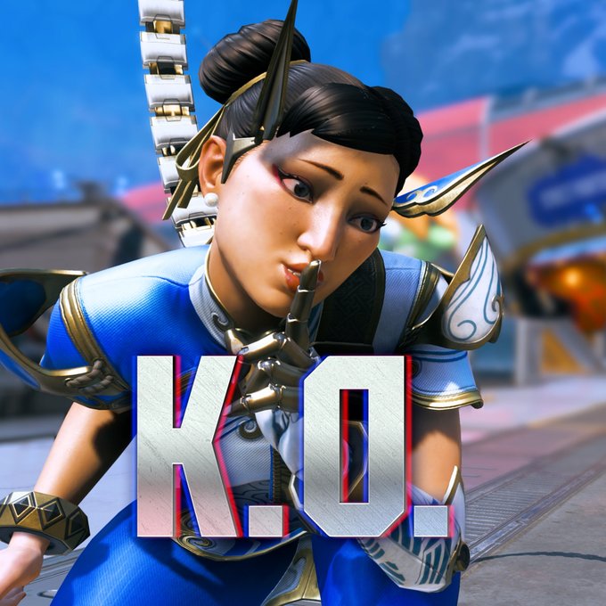 3D-rendered character of a woman in blue and gold armor with a surprised expression, making a 'shush' gesture, with the text 'K.O.' overlaid in large letters.