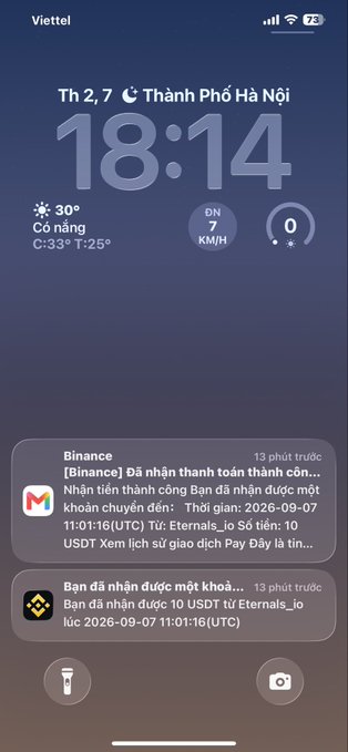 A smartphone lock screen in Vietnamese showing the time 18:14, weather for Hà Nội (30°C), Binance notifications regarding a 10 USDT payment to 'Eternals_io', and a Binance login notification.