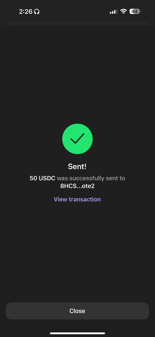 A mobile phone screen displays a successful transaction confirmation reading 'Sent! 50 USDC was successfully sent to 8HCS...ote2' with a green checkmark and a 'View transaction' link.