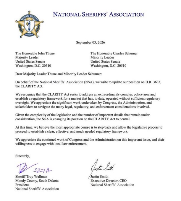 The image is a September 3, 2026 letter from the National Sheriffs' Association to Senate Majority Leader John Thune and Minority Leader Charles Schumer, signed by President Sheriff Troy Wellman (Moody County, South Dakota) and CEO Justin Smith, formally shifting the NSA's stance on the CLARITY Act (H.R. 3633) to neutral after previously opposing the crypto legislation.

This directly supports the post by serving as the primary source document confirming the sheriffs' group dropped its opposition to the CLARITY Act, validating the claim that a major law-enforcement objection to the crypto bill has been removed.