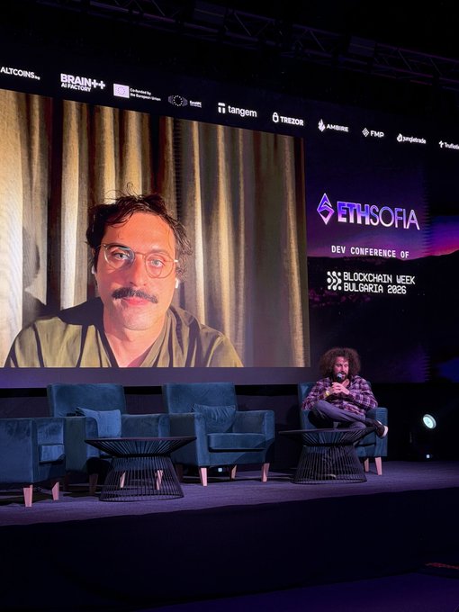 A photo from the ETHSofia Dev Conference during Blockchain Week Bulgaria 2025, showing a speaker on stage with his image displayed on a large screen behind him.