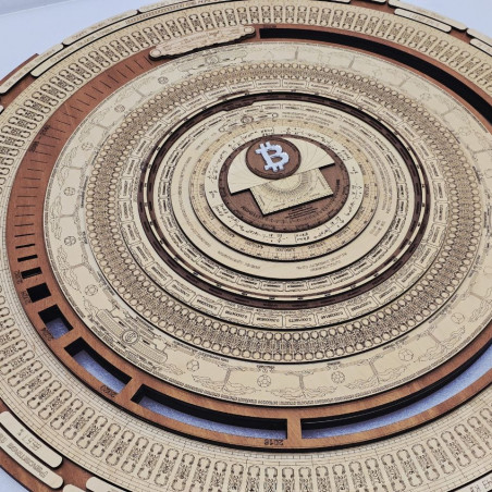 A detailed wooden laser-cut sculpture features concentric rings of intricate engravings surrounding a central Bitcoin logo, embodying the complexity of blockchain technology. The artwork, "The Bitcoin Full Node Sculpture 2 of 10" by @FractalEncrypt, visualizes the layered architecture of a Bitcoin full node through its ornate, mandala-like design.
