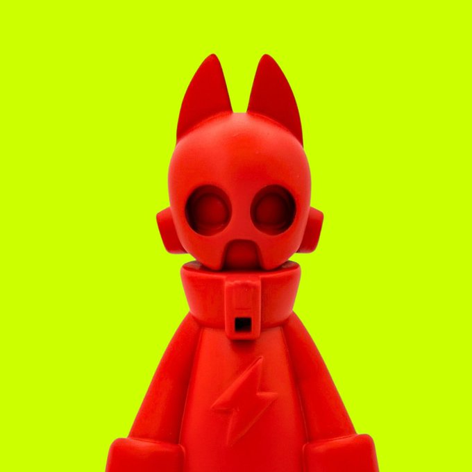 A red, hooded figure with cat-like ears, large hollow eyes, and a small lightning bolt emblem on its chest stands against a bright lime-green background. The character's quirky, almost surreal design complements the post's mention of "Eyzen Biterz" and its role within the relational Biterz class, hinting at the mysterious narrative surrounding its encounters.