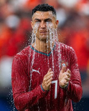A man wearing a red jersey with the number "7" and a Puma logo pumps his fists while water splashes dramatically around his face, evoking a tear-like effect that plays on the prediction market question "Will Ronaldo shed tears at the World Cup?"