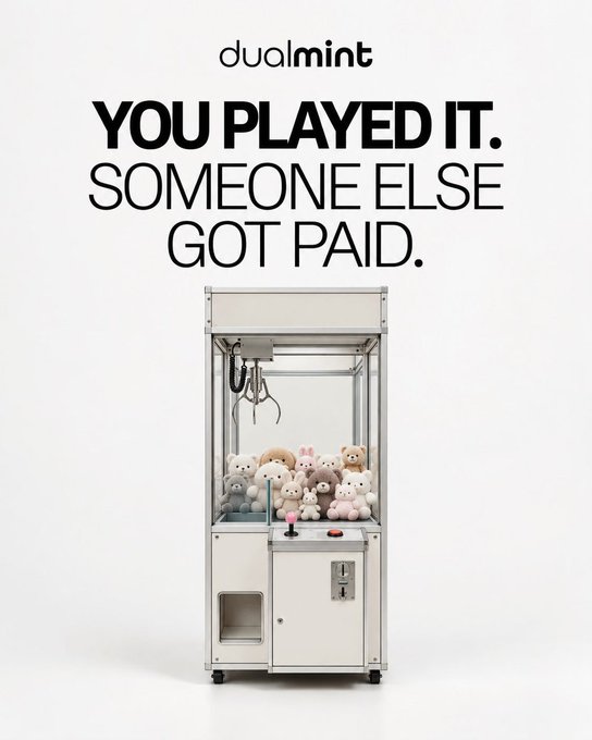 An advertisement for 'dualmint' featuring the bold text 'YOU PLAYED IT. SOMEONE ELSE GOT PAID.' above a photo of a claw machine filled with plush teddy bears.