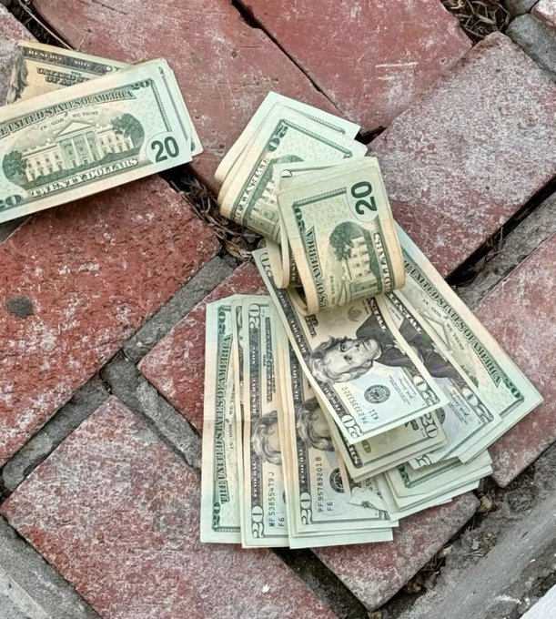 A bundle of U.S. $20 bills lies scattered across a brick surface, visually representing the "money will locate you" claim in the post. Serial numbers and denominations like "20" and "FJ97594201" are visible on the bills, reinforcing the "Drop 888" call-to-action.
