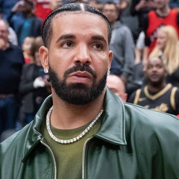 Drake appears visibly disappointed at a sporting event, his expression reflecting concern. The image relates to the post about his $1.5 million USDT bet loss on Argentina, who were defeated by Spain in the FIFA World Cup.
