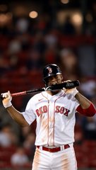 A Boston Red Sox baseball player wearing jersey number 24 takes a batting stance at the plate.