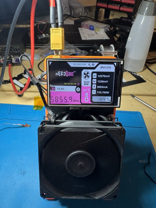 A NEOANT smart power device is connected to equipment on a workbench, with a color display showing readings including “13.8G,” “3020 RPM,” “1237mV,” “2230mV,” “6993mA,” and “10.750W.”