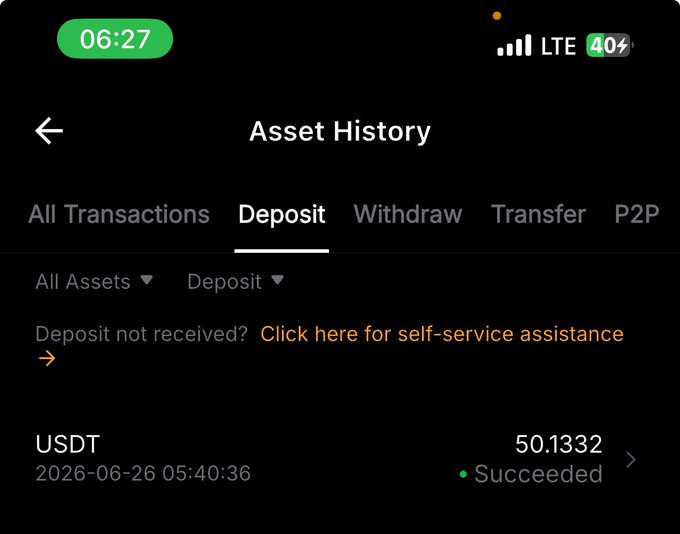A screenshot of a cryptocurrency app's Asset History showing a successful USDT deposit of 50.1332 on 2026-06-26 at 05:40:36, which appears to display the crypto earnings referenced in the post about getting paid for disliking posts.