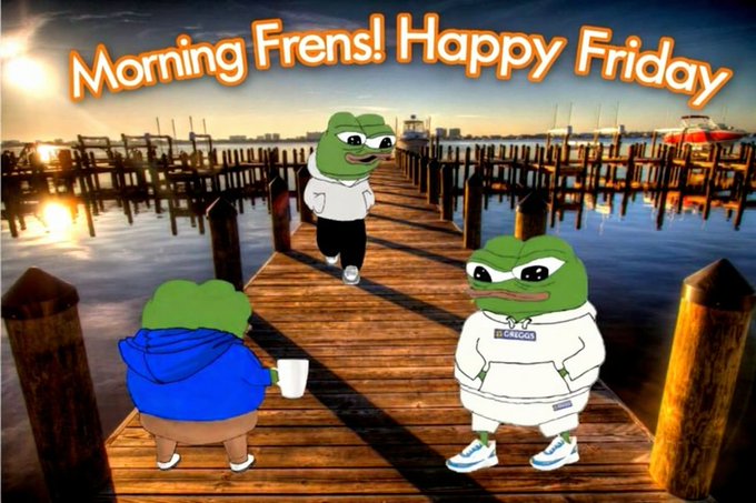 The image features a cartoon frog character standing on a wooden dock, surrounded by other cartoon frogs. The background of the image shows a beautiful beach scene with a sunset over the water. In the foreground, there are three cartoon frogs wearing hoodies and sneakers, positioned in front of a boat that is floating near the shoreline. Above them, an orange banner displays the text "MORNING FRENS! Happy Friday".